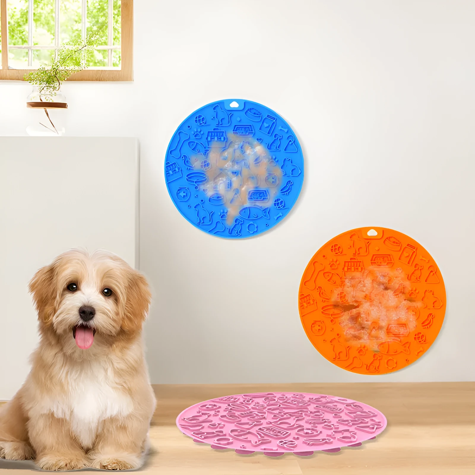 Round blue silicone pet licking mat with sucker base on a floor.