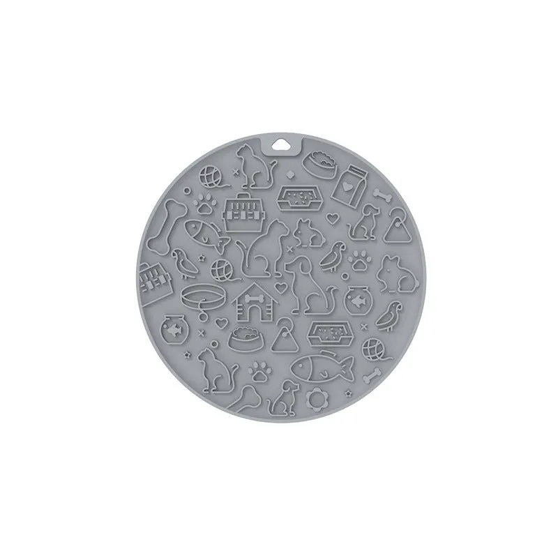 Round blue silicone pet licking mat with sucker base on a floor.