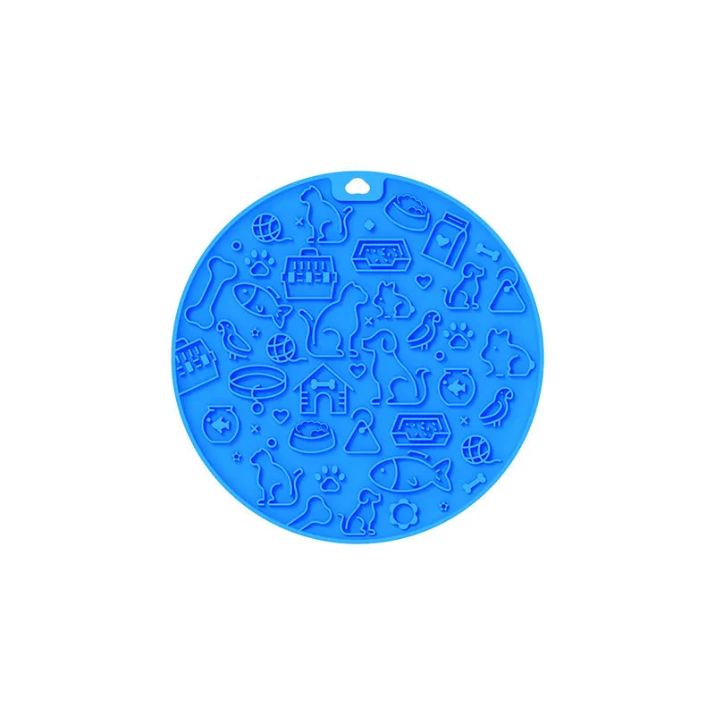 Round blue silicone pet licking mat with sucker base on a floor.
