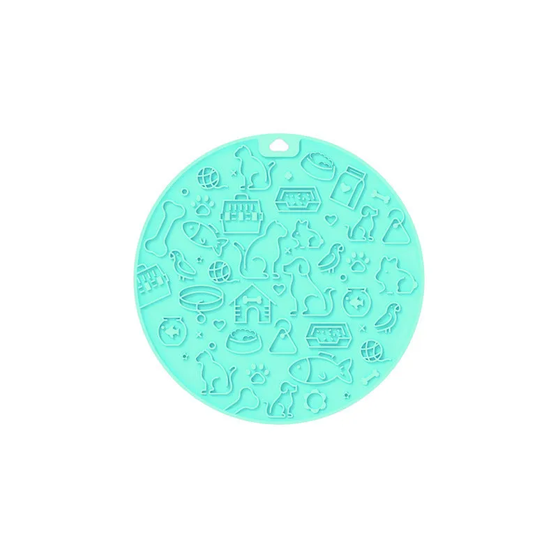 Round blue silicone pet licking mat with sucker base on a floor.