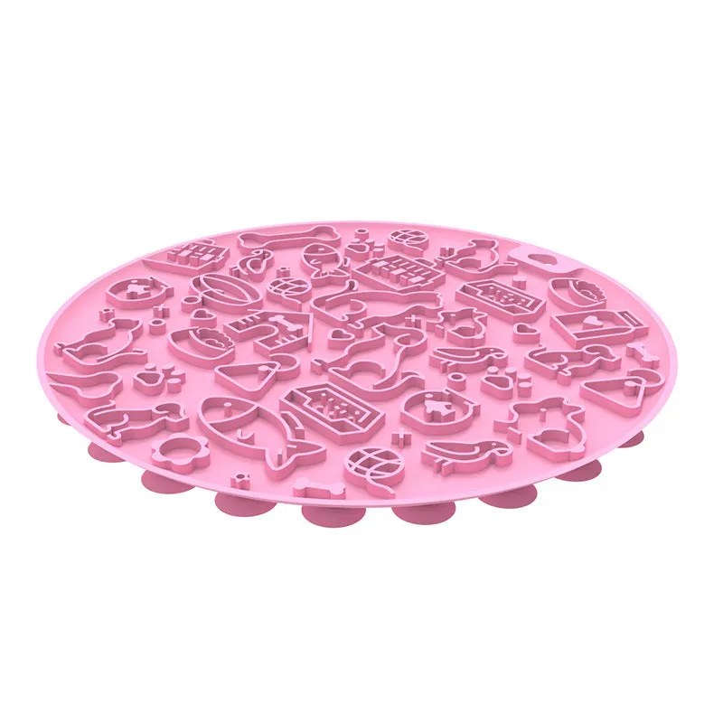 Round blue silicone pet licking mat with sucker base on a floor.