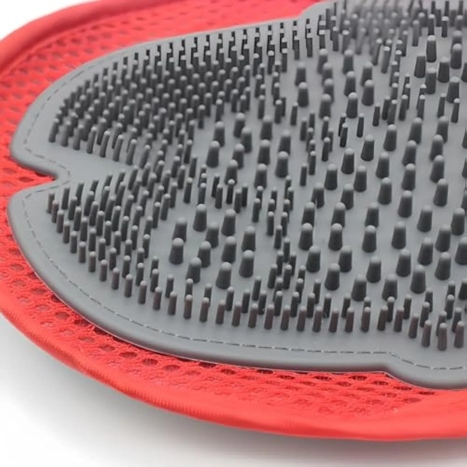 Red pet bathing glove with integrated cleaning brush for washing and grooming dogs or cats.