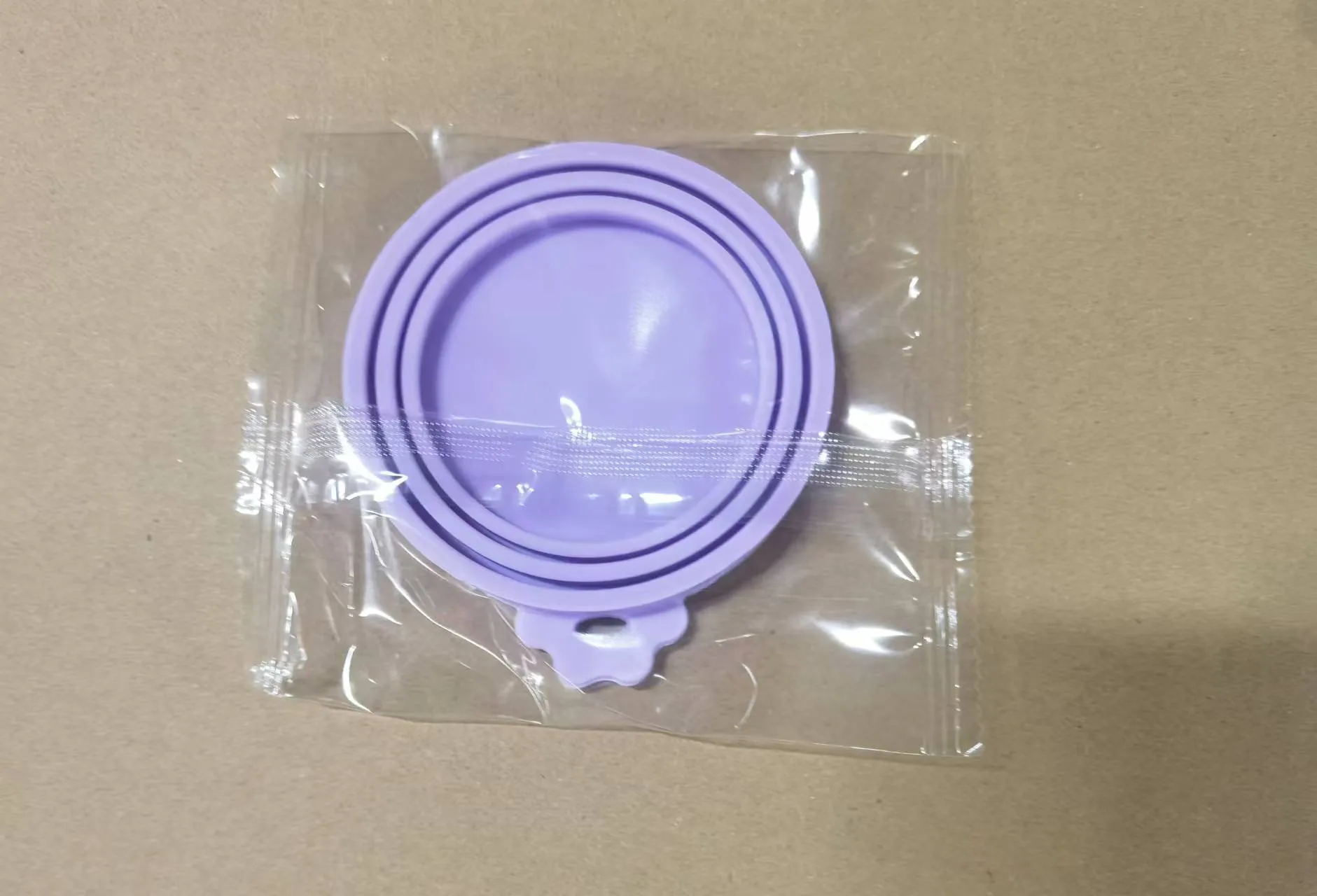 Silicone pet seal three-in-one can cover and spoon in sky blue on a pet food tin