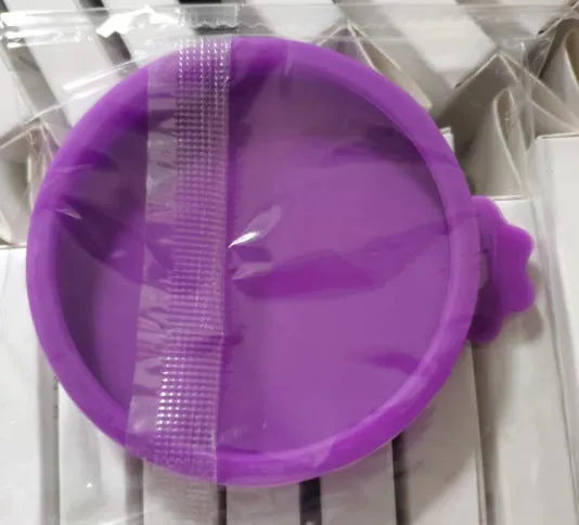 Silicone pet seal three-in-one can cover and spoon in sky blue on a pet food tin
