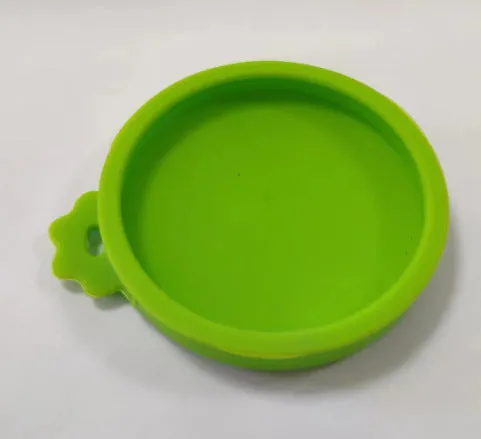 Silicone pet seal three-in-one can cover and spoon in sky blue on a pet food tin