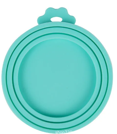 Silicone pet seal three-in-one can cover and spoon in sky blue on a pet food tin