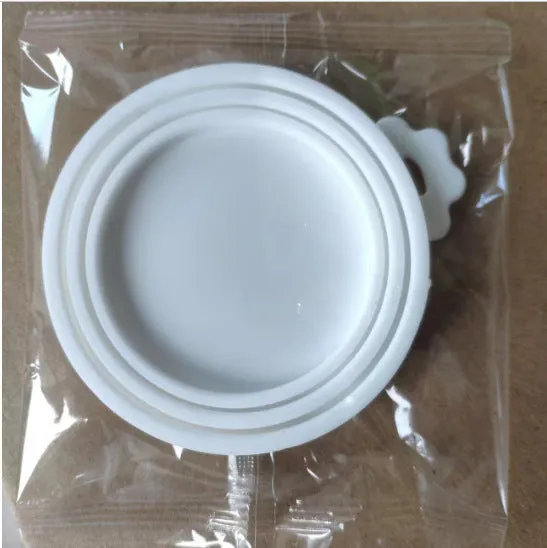 Silicone pet seal three-in-one can cover and spoon in sky blue on a pet food tin