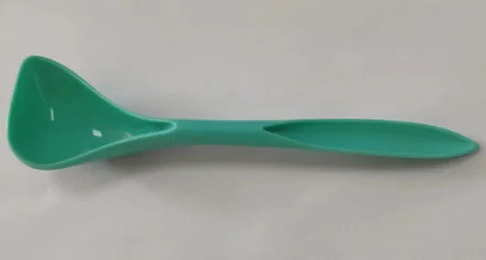Silicone pet seal three-in-one can cover and spoon in sky blue on a pet food tin