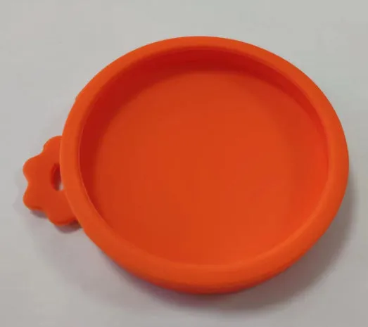 Silicone pet seal three-in-one can cover and spoon in sky blue on a pet food tin