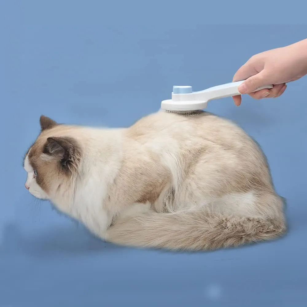 Self-cleaning pet brush with blue rubber handle and metal pins, shown with removed fur.