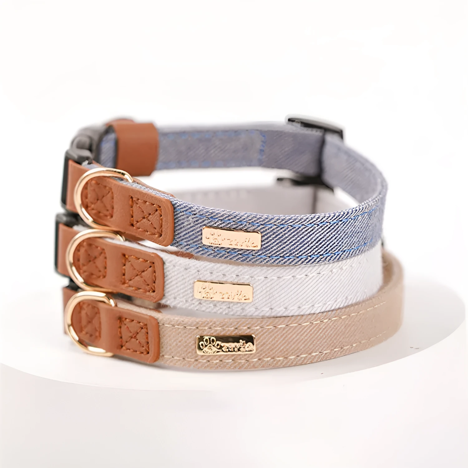 Adjustable mohair dog collar with nameplate and hand holding rope in cement gray