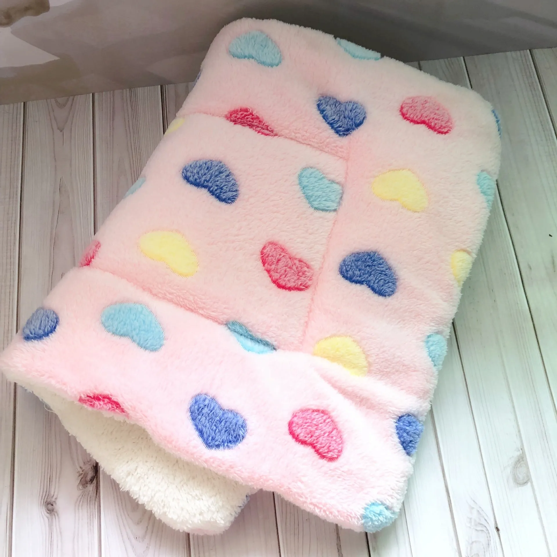 Thick flannel pet blanket in soft coral fleece for dogs cats on sofa