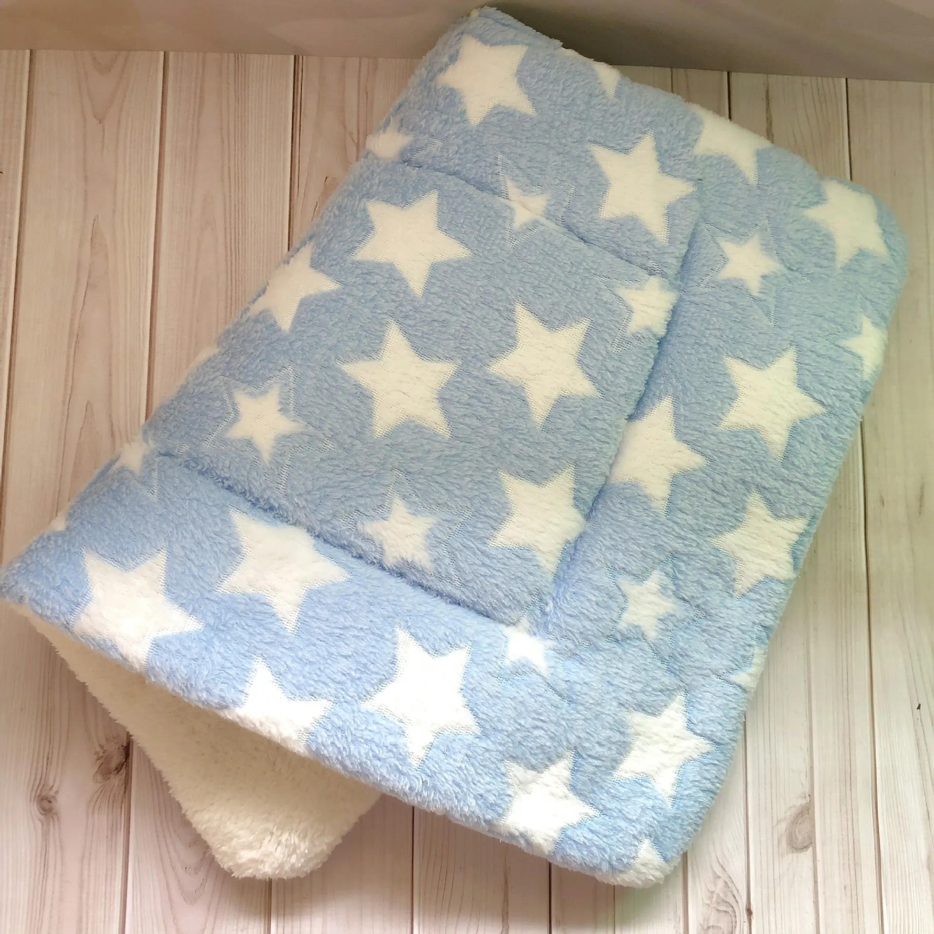 Thick flannel pet blanket in soft coral fleece for dogs cats on sofa