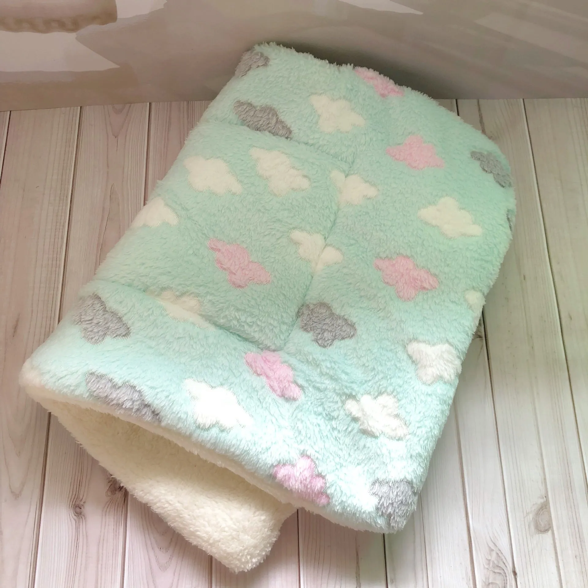 Thick flannel pet blanket in soft coral fleece for dogs cats on sofa