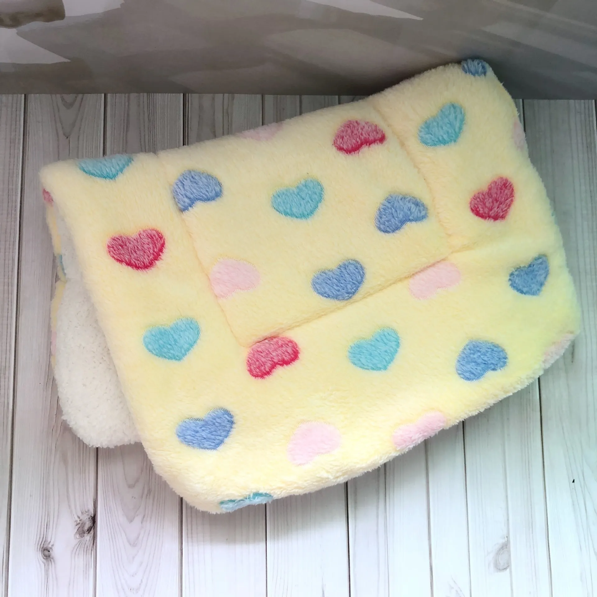Thick flannel pet blanket in soft coral fleece for dogs cats on sofa