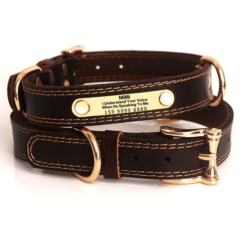 Genuine leather dog collar with engraved nameplate in brown on a wooden background