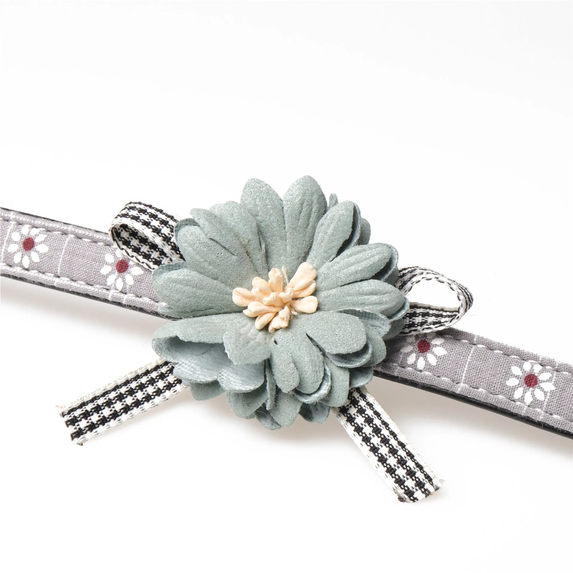 Pink PU dog collar with adjustable buckle and matching traction rope on a light background