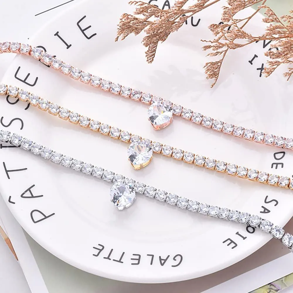Shiny rhinestone heart-shaped collar for dog or cat in gold, on a size chart showing S, M, L measurements.