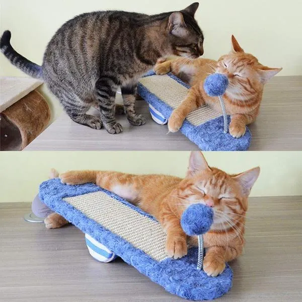 Royal blue cat seesaw toy with scratch board surface on a light background
