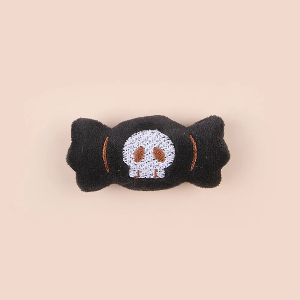 Plush cat teaser wand with candy-shaped attachment for interactive play