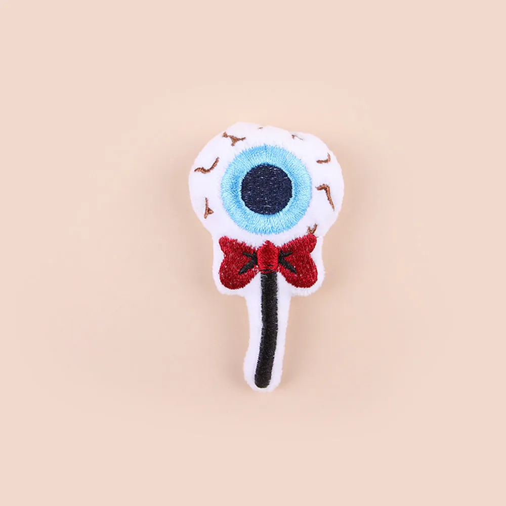 Plush cat teaser wand with candy-shaped attachment for interactive play