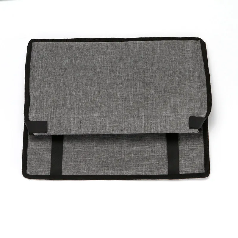 Foldable pet safety seat car bag in black Oxford cloth on a car seat with safety tether visible