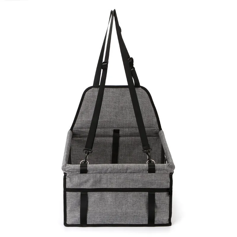 Foldable pet safety seat car bag in black Oxford cloth on a car seat with safety tether visible