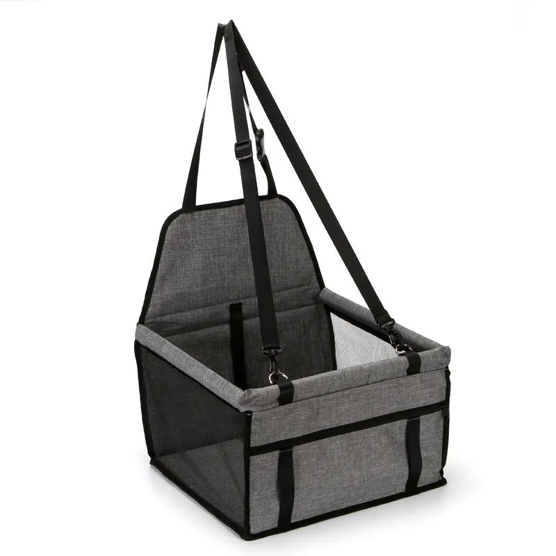 Foldable pet safety seat car bag in black Oxford cloth on a car seat with safety tether visible