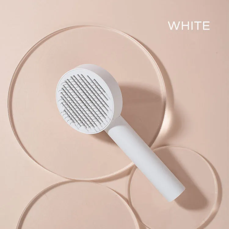 Pet cat comb hair brush for floating hair cleaner in white with one-click hair removal