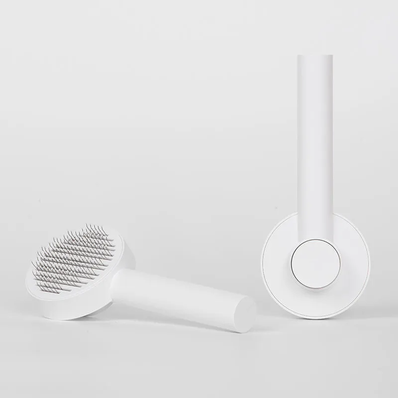 Pet cat comb hair brush for floating hair cleaner in white with one-click hair removal