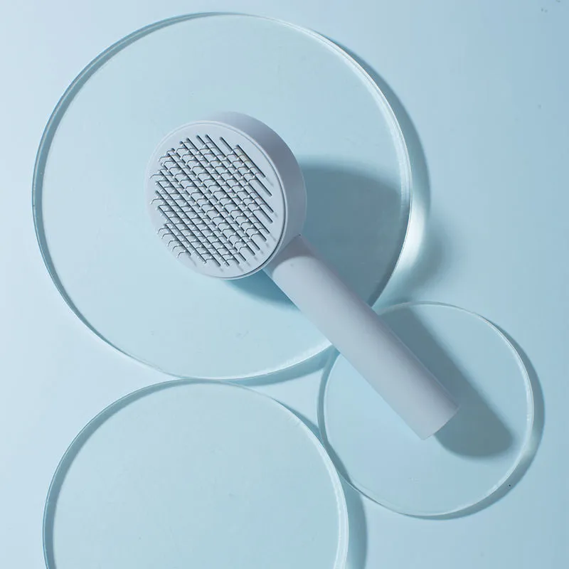 Pet cat comb hair brush for floating hair cleaner in white with one-click hair removal