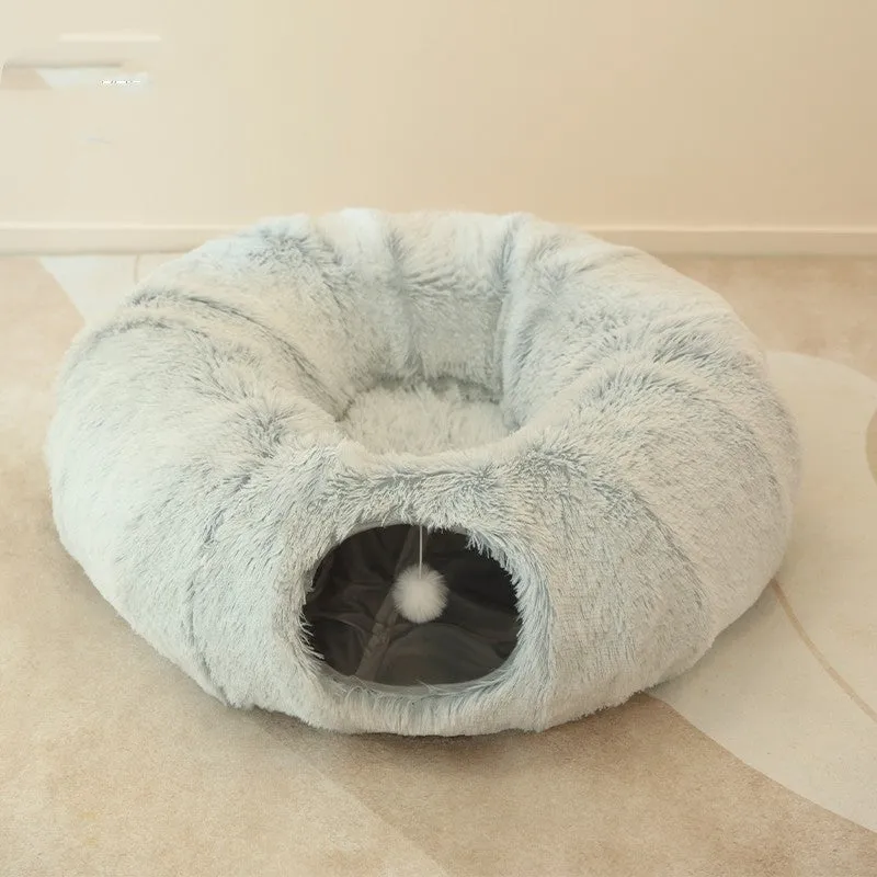 Closed cat tunnel nest 95cm made of long fluffy plush in rainbow colour on a wooden floor