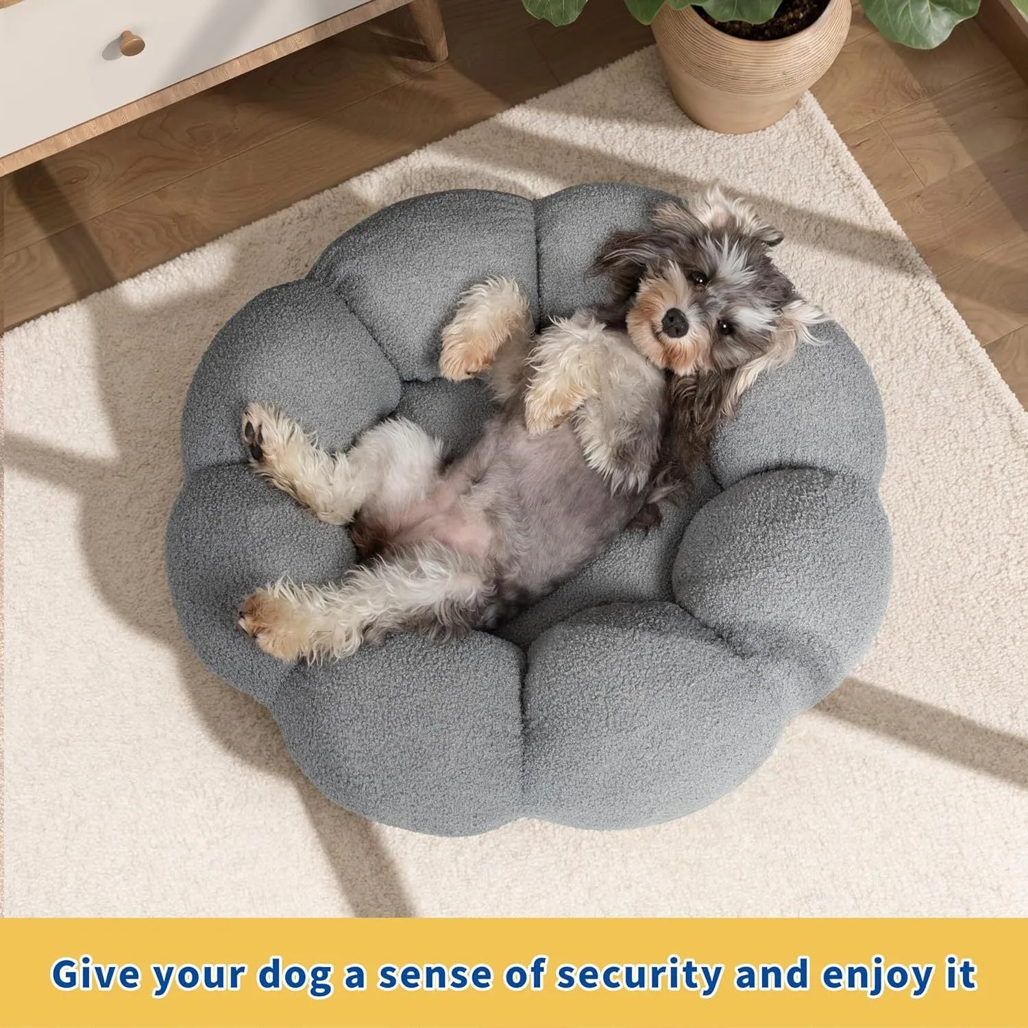 White fluffy flower-shaped pet bed with raised teddy fleece edges and round donut design on a light floor