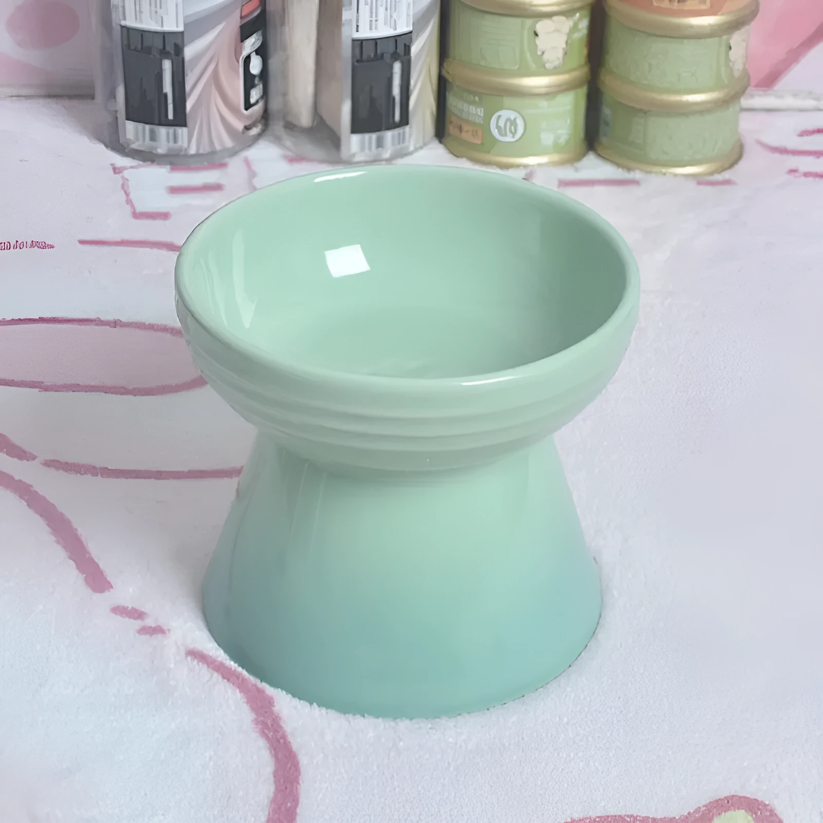 Ceramic pet bowl with a high foot and wide rim for dogs and cats.