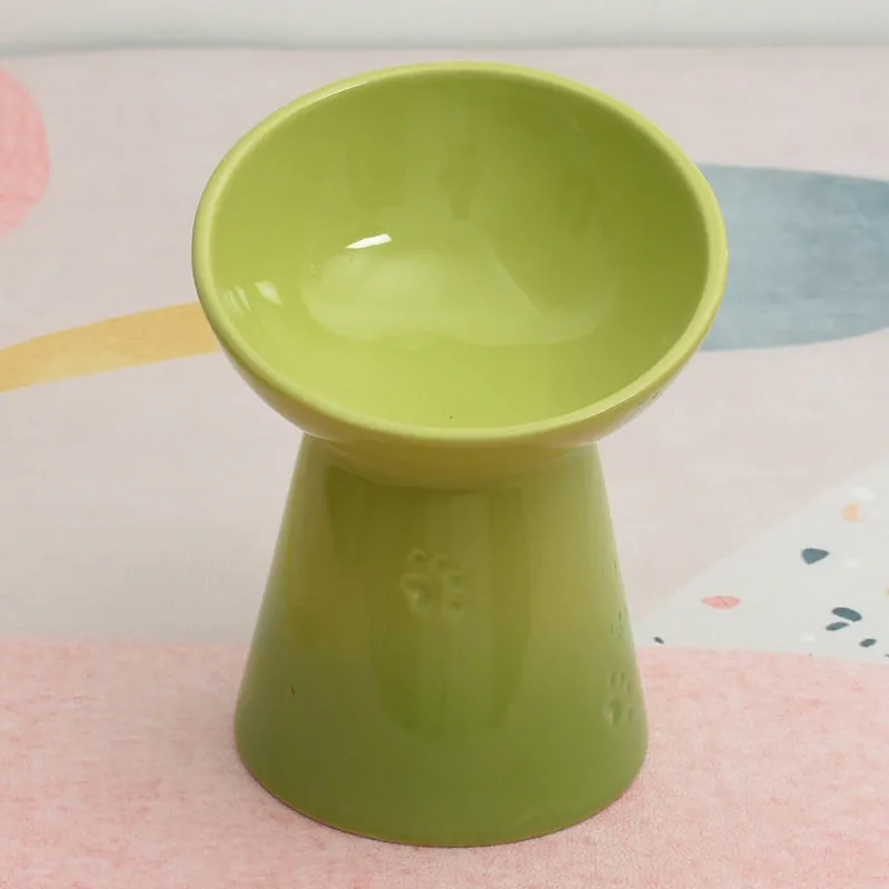 Ceramic pet bowl with a high foot and wide rim for dogs and cats.