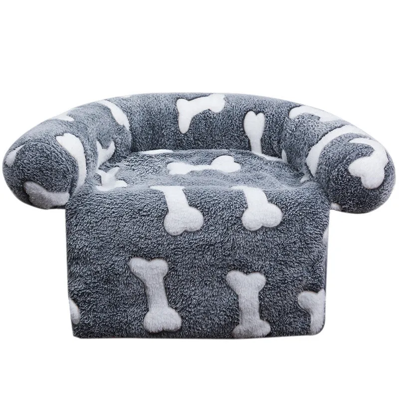 Plush kennel sofa blanket in orange star moon colour on a light background