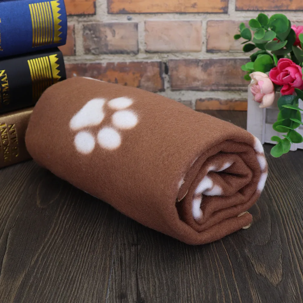 Pet warm blanket with paw print design double-sided fleece in blue colour, laid flat on a surface