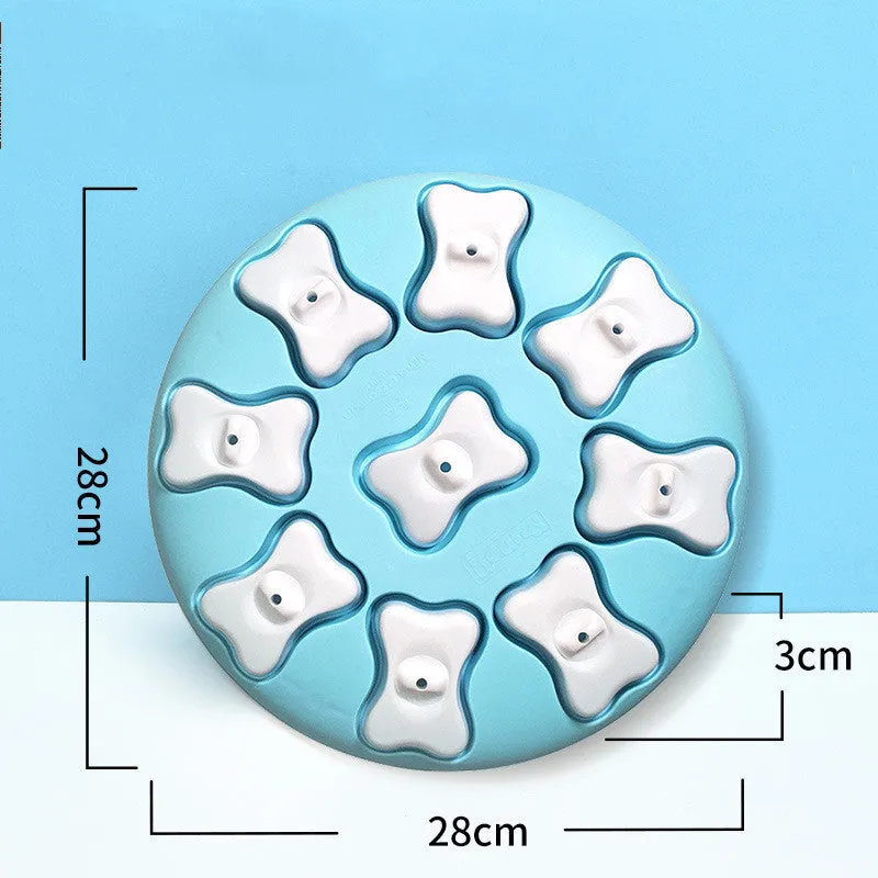 Blue interactive dog puzzle toy with nine compartments and bone covers on a light background