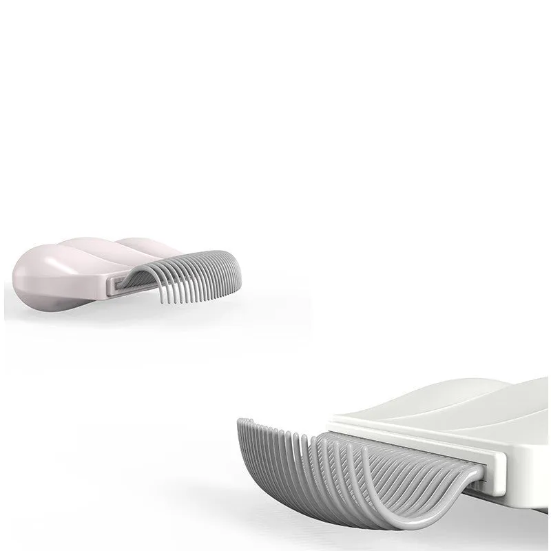 Paw Soft deshedding brush for pets in blue, pink, or white on a white background.