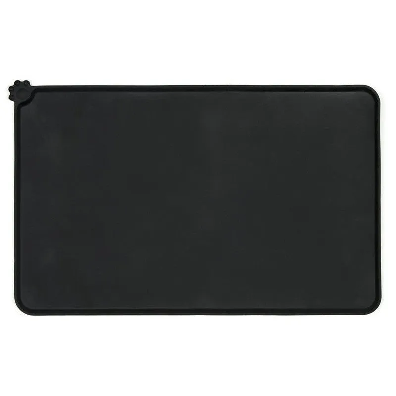 Black silicone dog food mat measuring 47 by 30 centimetres with non-slip surface and raised edges.