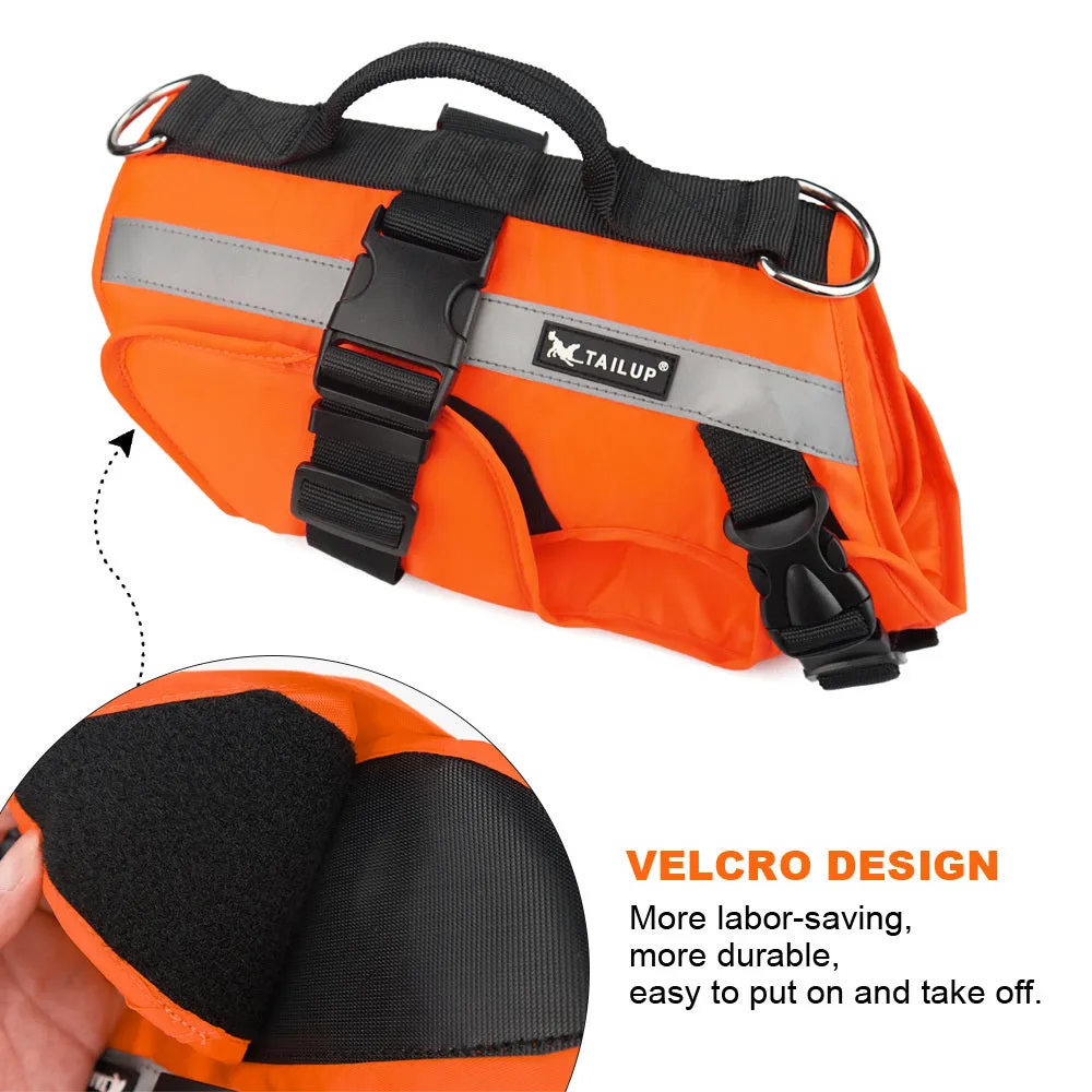 Reflective orange dog life jacket vest with double-layer buoyancy and Velcro fastening on green grass