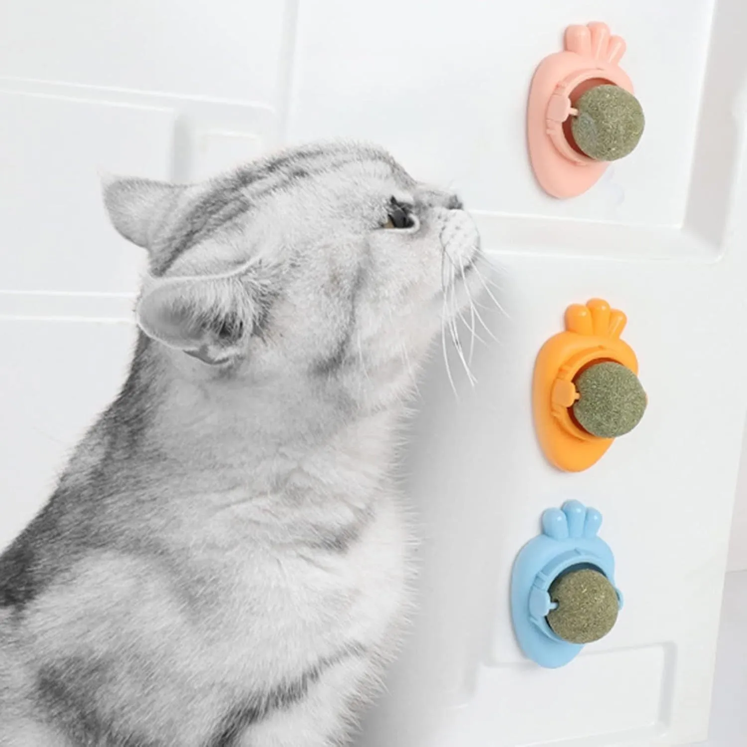 Blue carrot-shaped self-adhesive catnip toy for wall mounting and cat teeth cleaning.