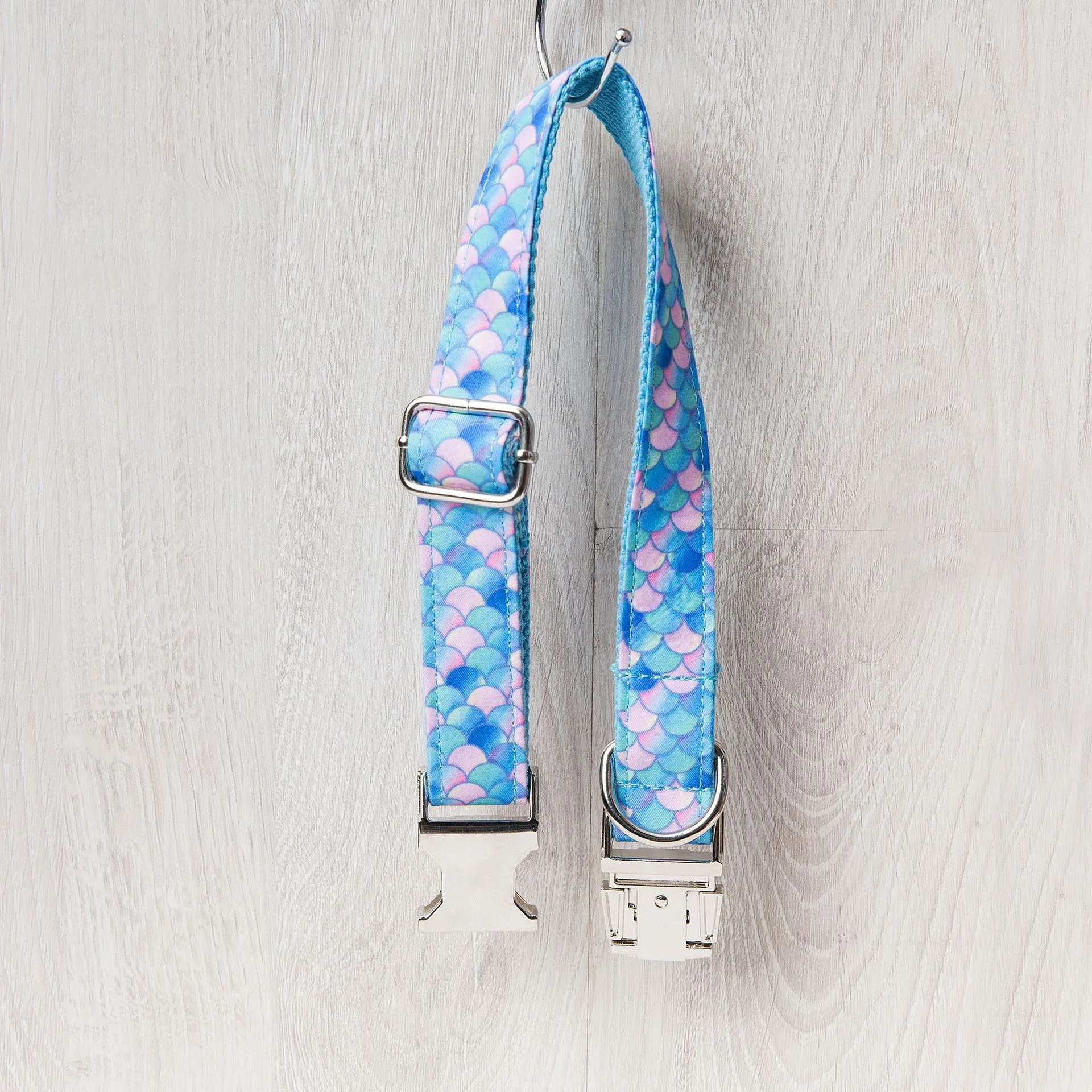Blue mermaid polyester adjustable pet collar on white background showing buckle and size label