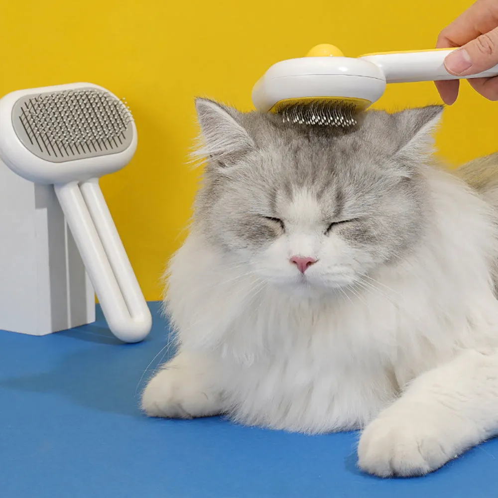 Cat dog grooming brush with stainless steel teeth and white silicone tips on a gray handle