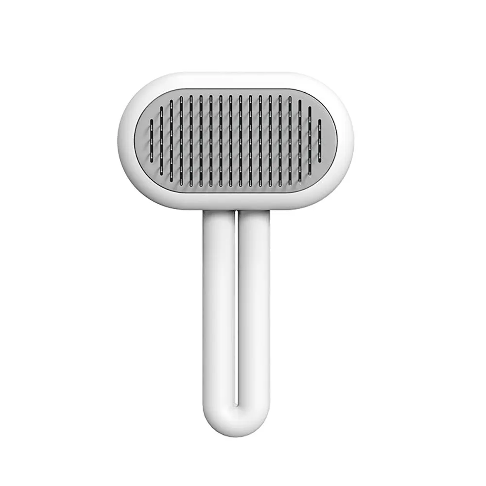 Cat dog grooming brush with stainless steel teeth and white silicone tips on a gray handle