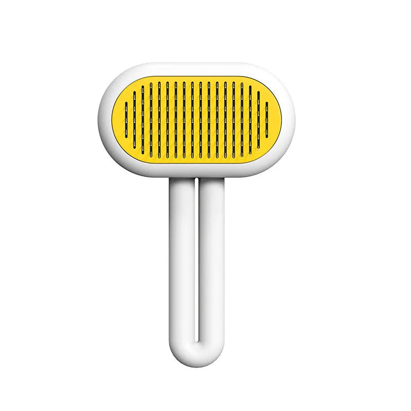 Cat dog grooming brush with stainless steel teeth and white silicone tips on a gray handle