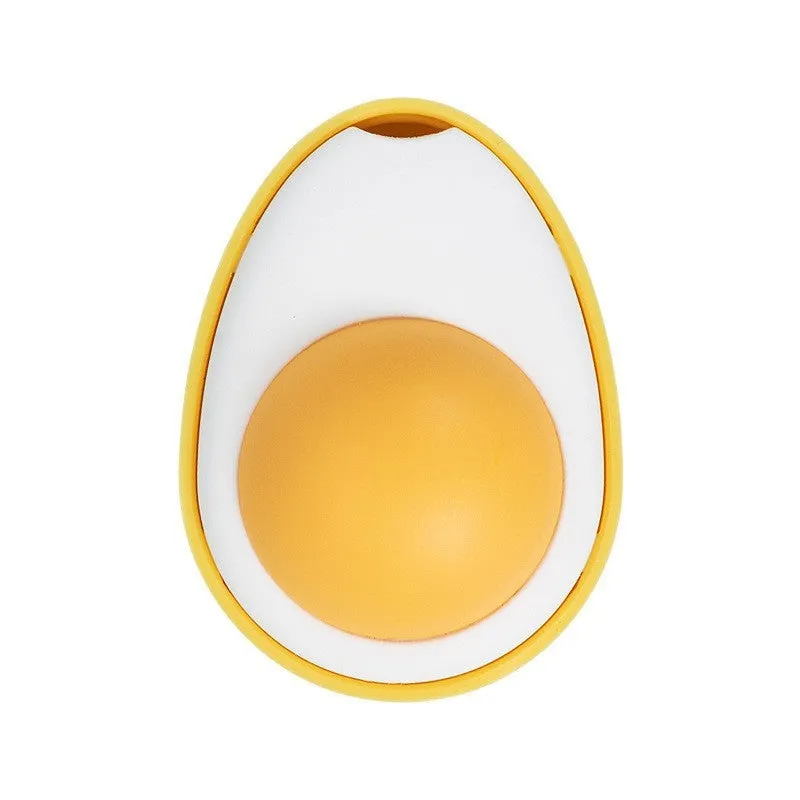 Interactive catnip ball toy with egg design mounted on wall for feline play