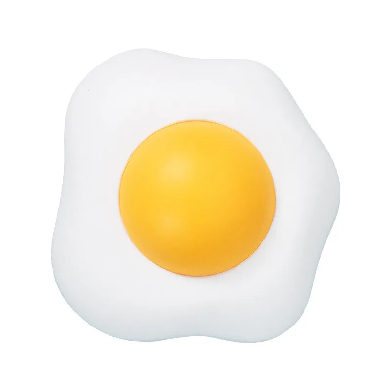 Interactive catnip ball toy with egg design mounted on wall for feline play