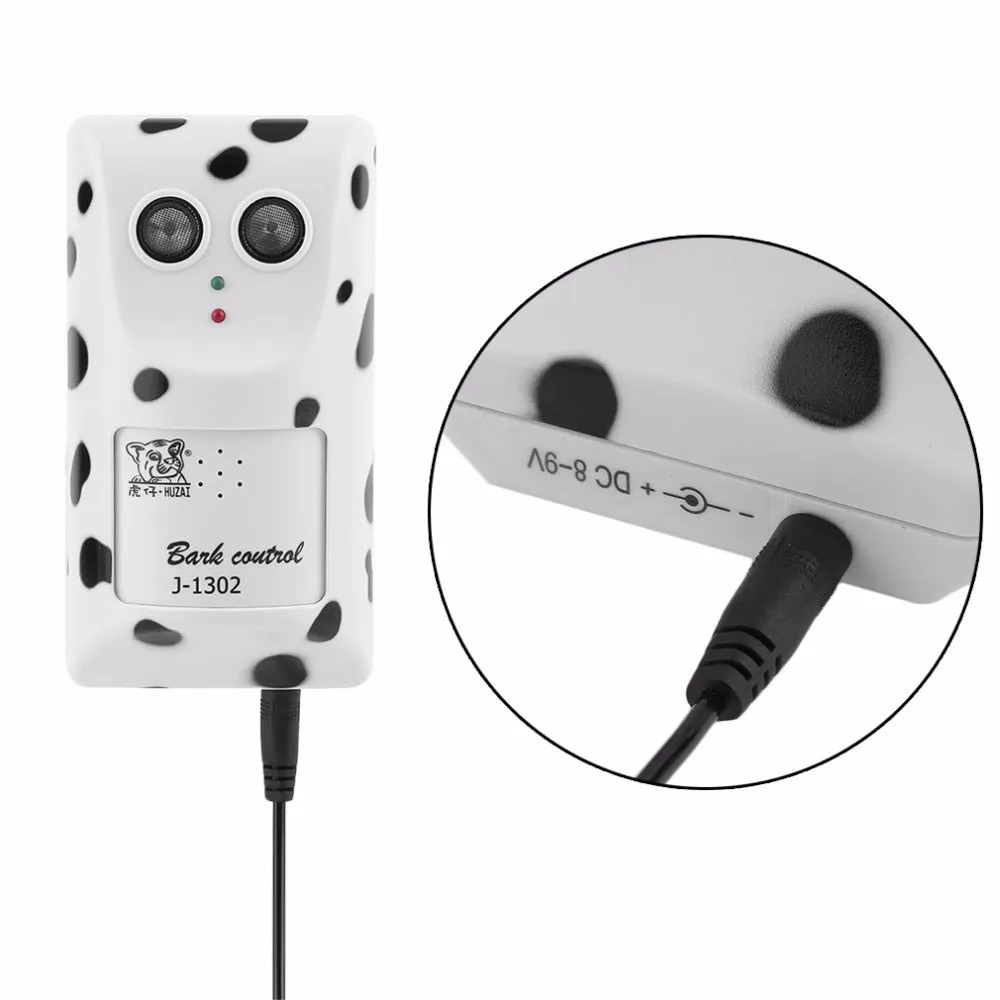 White anti-barking ultrasonic dog repeller mounted on a wall with rotary holder, 7x13x5cm