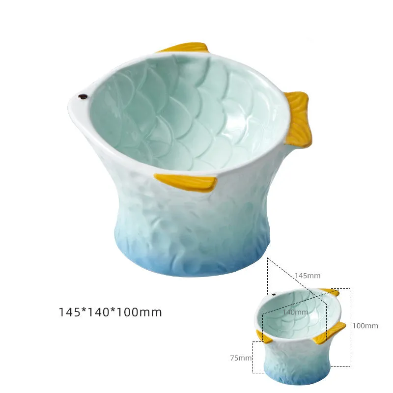 Set of four blue fish-shaped ceramic cat bowls with tilted, elevated design on a table.